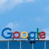 Google sign on top of a building with blue sky