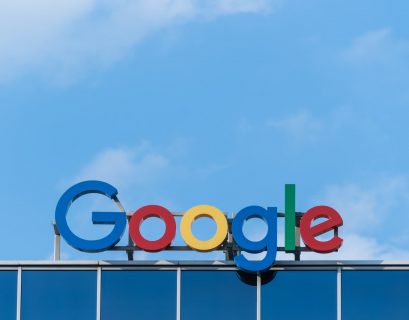 Google sign on top of a building with blue sky